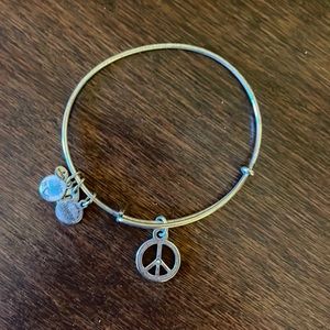 Silver peace sign Alex and Ani bracelet